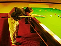 Child playing snooker